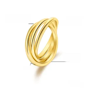 Macro shot of 2mm width triple intertwined rings in polished gold plated titanium steel