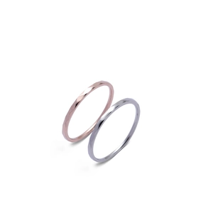 Rhombic irregular rose gold and silver 2mm stainless steel rings on white background