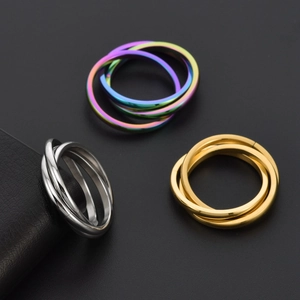 Polished titanium steel interlocking trinity rings in silver, gold, and rainbow finishes
