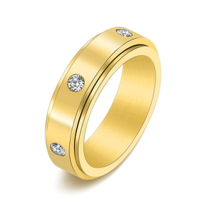 Bague rotative en acier inoxydable doré avec trois diamants ronds étincelants