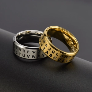 Mens spinning stainless steel rings in gold and silver with engraved letters and symbols