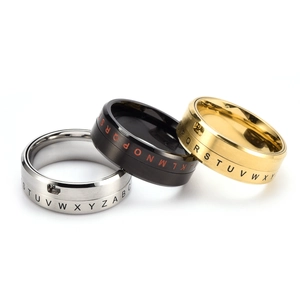 Set of 3 rotating stainless steel rings in silver, black and gold with letter engraving