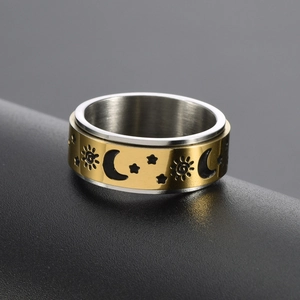 Bague rotative bicolore avec motifs célestes soleil lune et étoiles en acier doré argent
