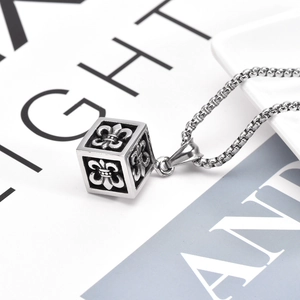 Retro stainless steel cube pendant necklace with embossed fleur-de-lis on metal chain