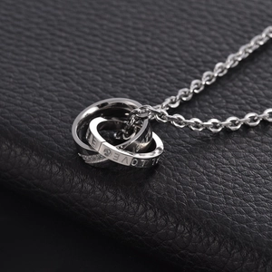 Minimalist double interlocking ring necklace with LOVE engraving and crystal stone accents