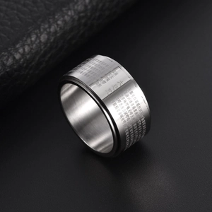 Rotatable stainless steel 12mm wide band ring featuring engraved Buddhist scripture motifs