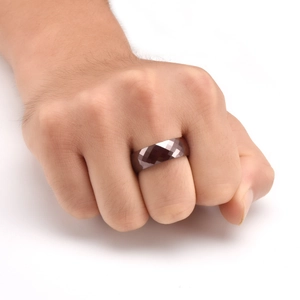Close-up of 8mm faceted ceramic ring with a dark grey geometric diamond cut for men