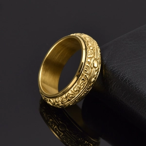 Vintage gold spinning astronomical ball ring in stainless steel with carved patterns
