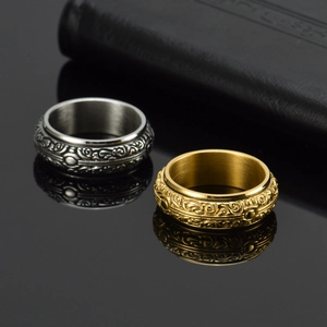 Vintage rotating astronomical sphere rings in silver and gold with engraved patterns