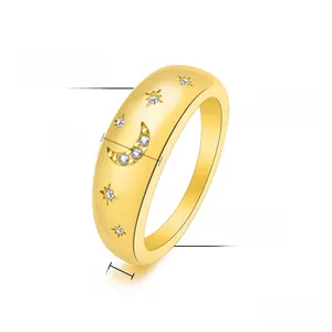 Detail view of 7mm gold plated titanium steel ring with star moon motifs and zircons