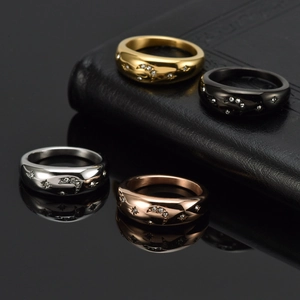 Polished star and moon engraved titanium rings set with zircons in four metallic colors