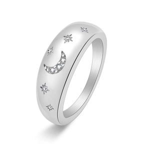 Polished stainless steel moon and star ring with sparkling crystals on white background