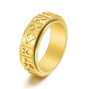 Detail showing Nordic runes on rotating golden stainless steel ring for men