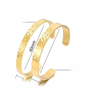 Detail view of hammered gold stainless steel bangles with 6.5mm and 8.5mm widths