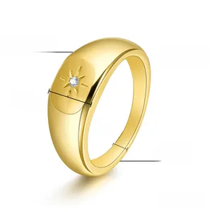Detailed view of gold signet ring with star-set cubic zirconia and 8mm width dimensions