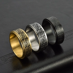 Three-piece Celtic knot stainless steel spinner rings in gold, silver, and black tones