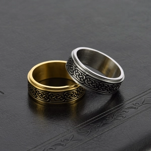 Nordic Celtic knot spinner rings in gold and silver stainless steel on black leather