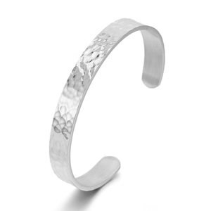 Detail view of silver hammered texture cuff bracelet with minimalist open design