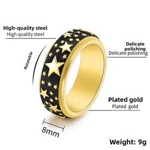 Detail showing 8mm rotatable titanium steel star ring with gold plating and polished finish