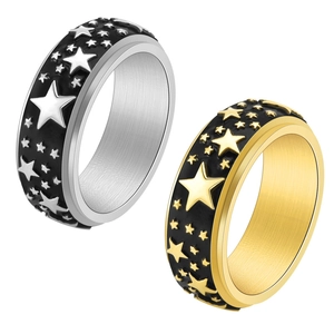 Vintage stainless steel spinner rings in silver and gold with star patterns