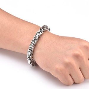 Detailed view of silver Byzantine link bracelet in polished stainless steel for men