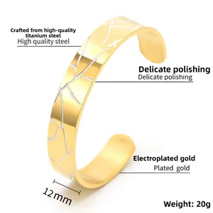 Detail view of 12mm wide titanium steel C-shape bracelet with gold plating and wood crackle