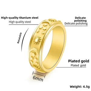Macro detail of 6mm golden spinner ring showing sun and moon engraved patterns