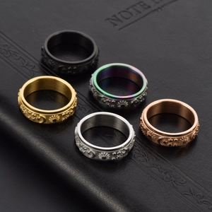 Set of five 6mm rotatable spinner rings with sun moon star engraving in multi-color finishes