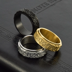 Stainless steel Celtic knot spinner ring set in black, gold and silver finishes