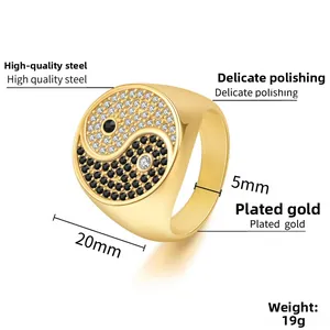 Macro view of gold-plated stainless steel ring with Yin Yang black and white cubic zirconia