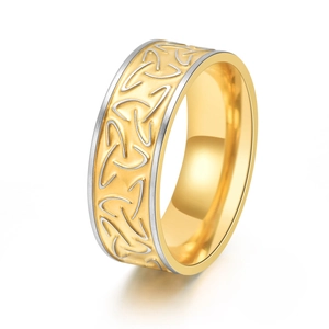 Macro detail of bicolour Viking Triquetra knot engraved on a vintage titanium steel ring