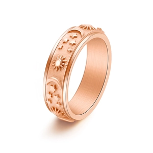 6mm rose gold celestial spinning ring with sun moon and star motifs on white background