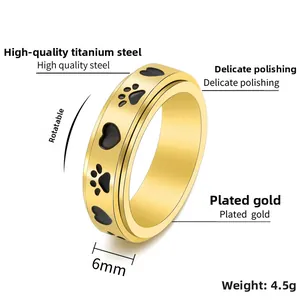 Detail view of 6mm rotatable gold titanium steel ring with heart and paw prints