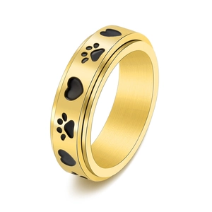 Golden rotating stainless steel ring featuring black heart and paw prints decoration