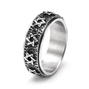 Detailed close-up of retro rotating star ring with vintage hammered finish and silver relief