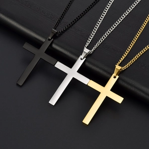 Polished stainless steel cross necklaces in black, gold, and silver on leather