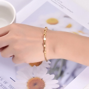 Minimalist gold C-shaped titanium steel bracelet featuring five sliding square beads for women