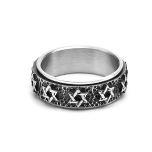 Macro detail of vintage hexagram relief on wide spinning band with aged silver finish