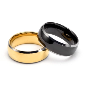 Modern gold and black tungsten steel rings with polished finish and beveled edges