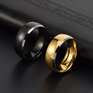 Polished black and gold tungsten steel rings with silver beveled edges on leather