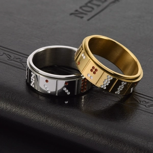 Spinning stainless steel rings with domino pattern in gold and silver finish
