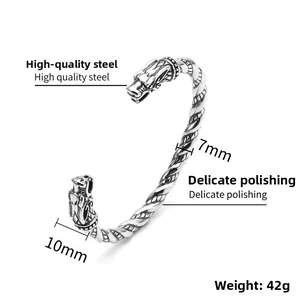 Detailed close-up of retro Viking dragon head bangle made of durable titanium steel