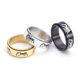 Three-color spinner rings in gold, silver, and black with pinky swear hand engraving