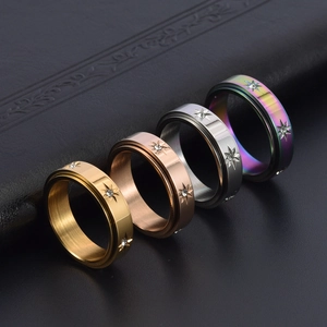 Bagues rotatives en acier inoxydable avec gravure soleil et pierres en zircone brillantes