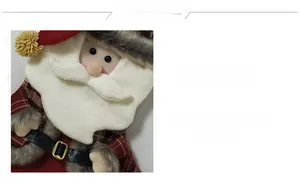 Detail of handmade Christmas stocking featuring Santa Claus with red plaid and faux fur trim