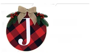 Detailed view of JOY Christmas wreath with red black plaid pattern and pine needles