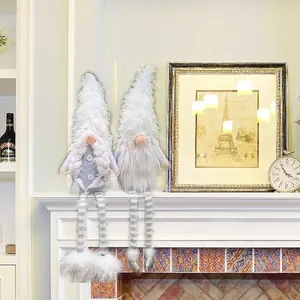 Pair of Christmas faceless gnomes with long striped legs and silver sequin boots