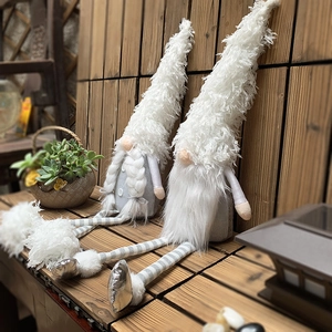 Set of two Nordic long-legged Christmas gnomes with white faux fur hats and grey bodies