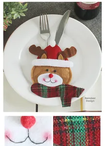 Detail of Christmas reindeer cutlery holder made of felt for festive table settings