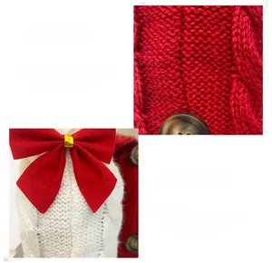 Close-up of knitted Christmas wine bottle cover with red bow and brown button detail